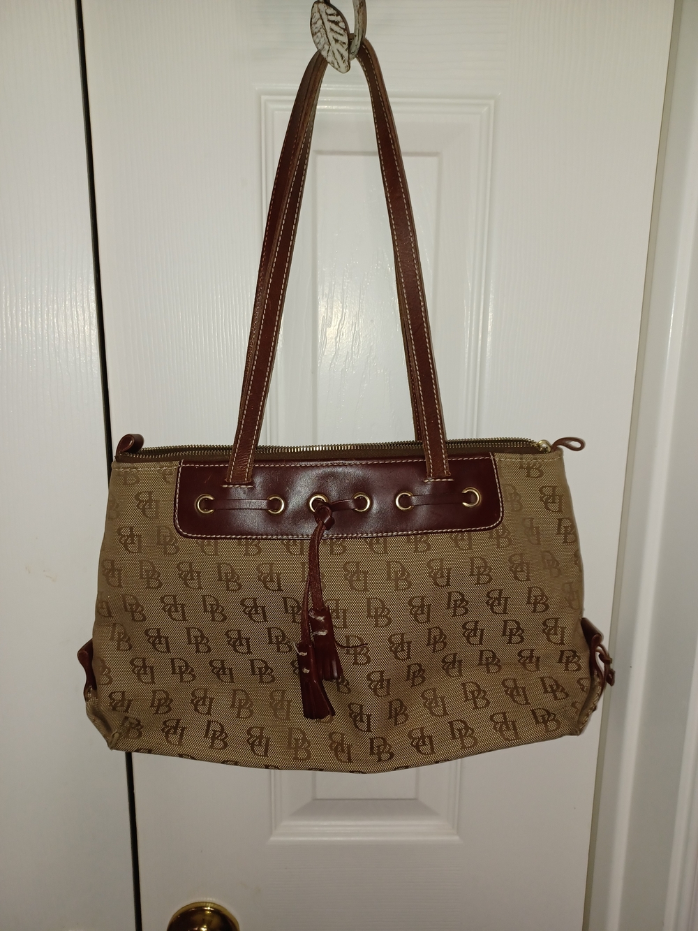 Dooney & Bourke Brown Monogram Canvas Tote Bag with Tassel Accent
